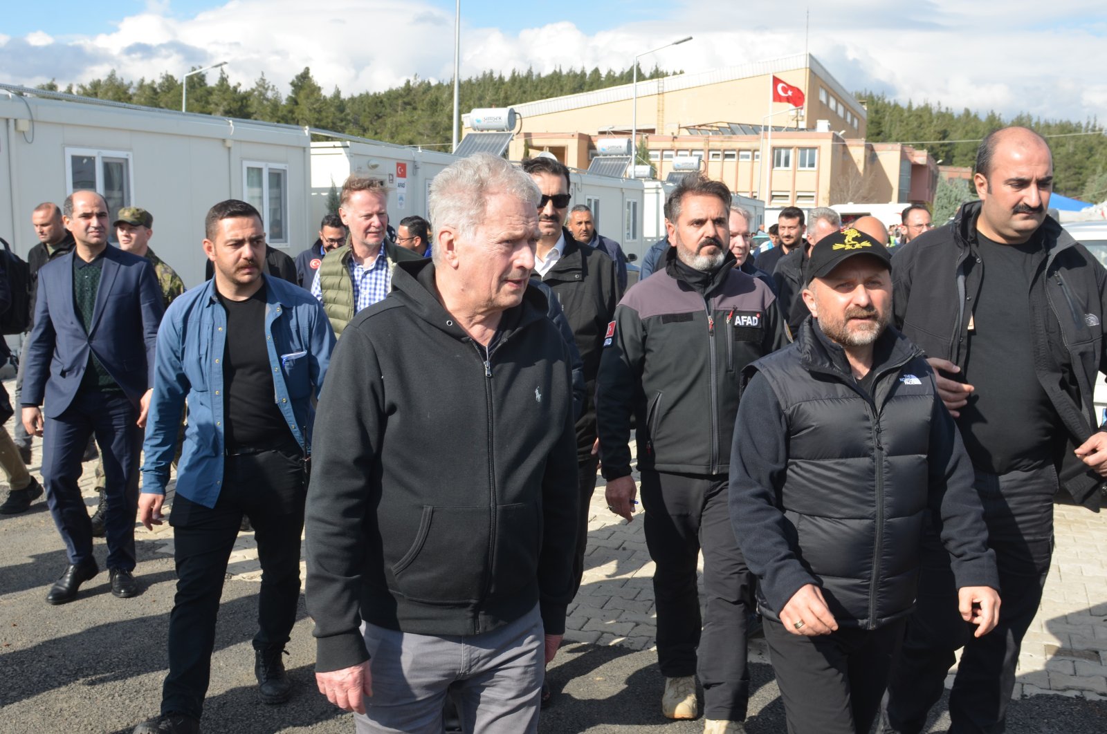 Finnish President Sauli Niinisto visits earthquake survivors at the Karacasu Container City in Kahramanmaraş province, March 16, 2023. (IHA Photo)