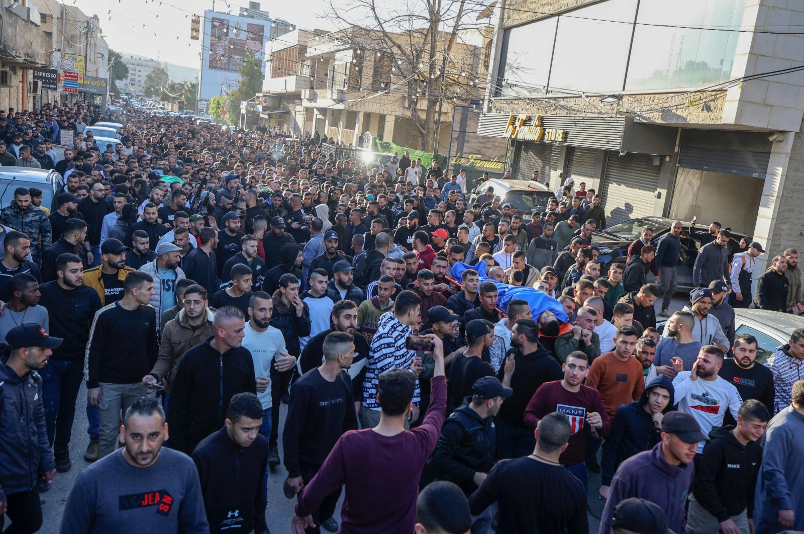 Mourners carry the bodies of Palestinians killed in an Israeli raid earlier in the day, during their funeral in Jenin city in the occupied West Bank, Palestine, March 16, 2023. (AFP Photo)