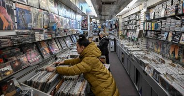 Celine Court browses through records at Village Revival Records in New York City, U.S., March 14, 2023. (AFP Photo)