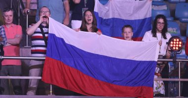 Spectators wave the Russian flag as they watch the bouts at the IBA World Women&#039;s Boxing Championships, New Delhi, India, March 17, 2023. (EPA Photo)