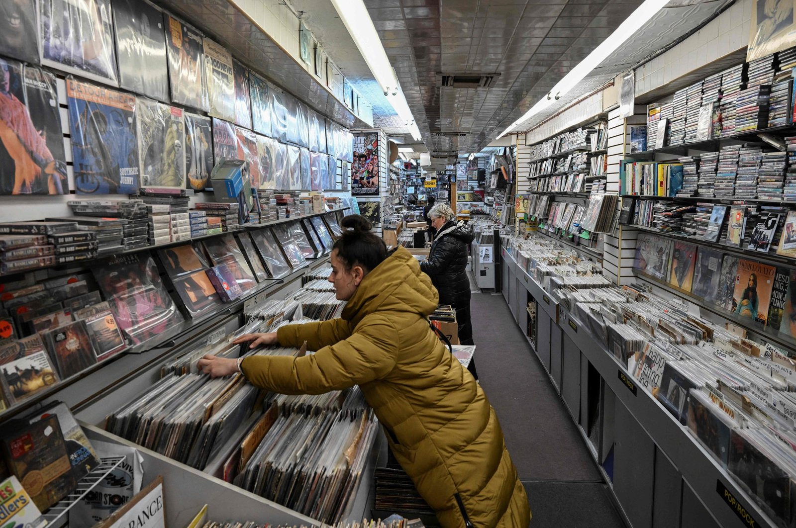 Celine Court browses through records at Village Revival Records in New York City, U.S., March 14, 2023. (AFP Photo)