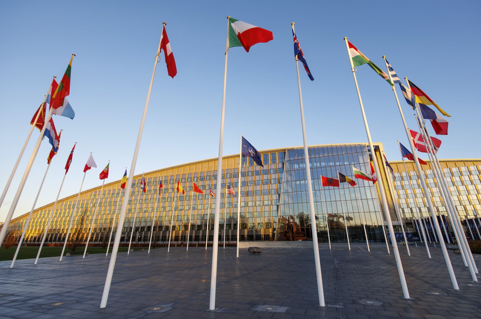 Flags of NATO members fly outside the NATO headquarters, Brussels, Belgium, Nov. 16, 2022. (AP File Photo)