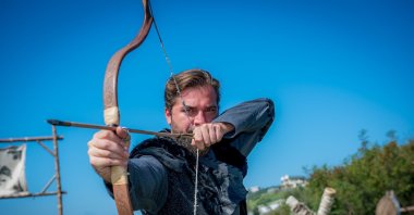 Engin Altan Düzyatan poses with a bow on the set of "Diriliş: Ertuğrul" ("Resurrection: Ertuğrul"), Oct. 14, 2015. (Photo by Yağmur Dinç)