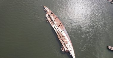 An aerial view of the "Al-Mansur" yacht, once belonging to former Iraqi President Saddam Hussein, which has been lying on the water bed for years in the Shatt al-Arab waterway, Basra, Iraq, March 9, 2023. (Reuters Photo)