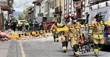 Emergency personnel respond to damage after an earthquake, Cuenca, Ecuador, March 18, 2023. (EPA Photo)