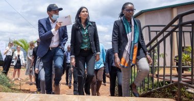 British Home Secretary Suella Braverman walks with Paul Rwigamba, Director of Projects and Property Management and Flora Uwayezu, Project Sales of the Century Real Estate group during a tour in Kigali Rwanda, March 18, 2023. REUTERS/Stringer