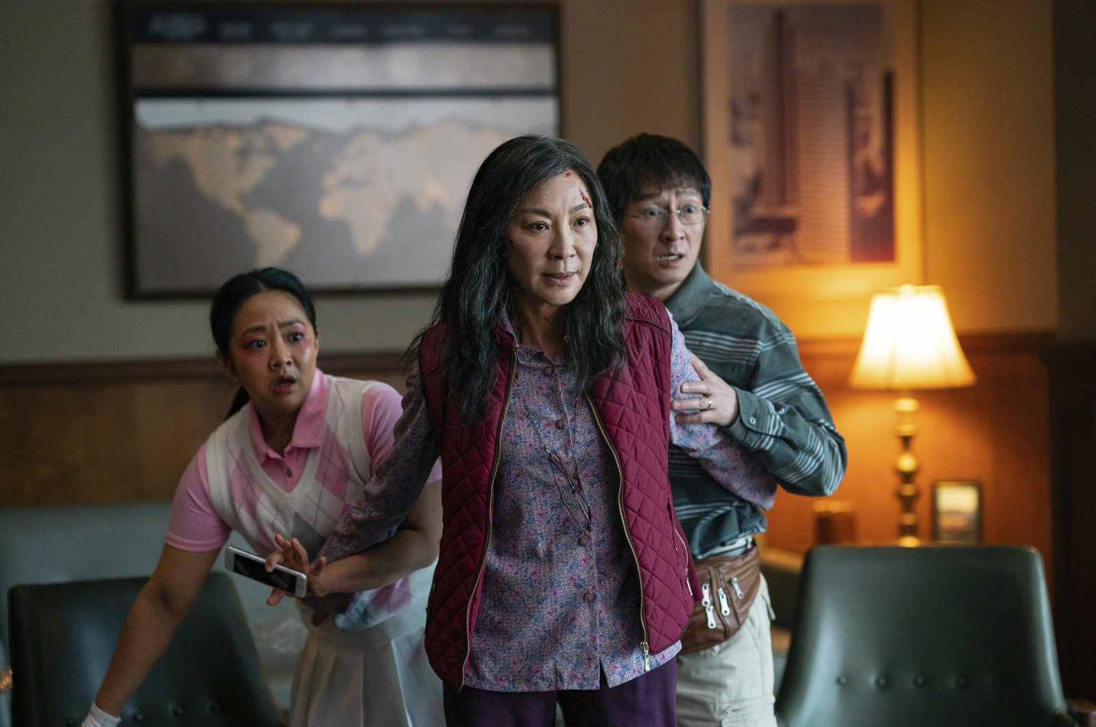 This image, released by A24 Films, shows, from left, Stephanie Hsu, Michelle Yeoh and Ke Huy Quan in a scene from, &quot;Everything Everywhere All At Once.&quot; (AP Photo)