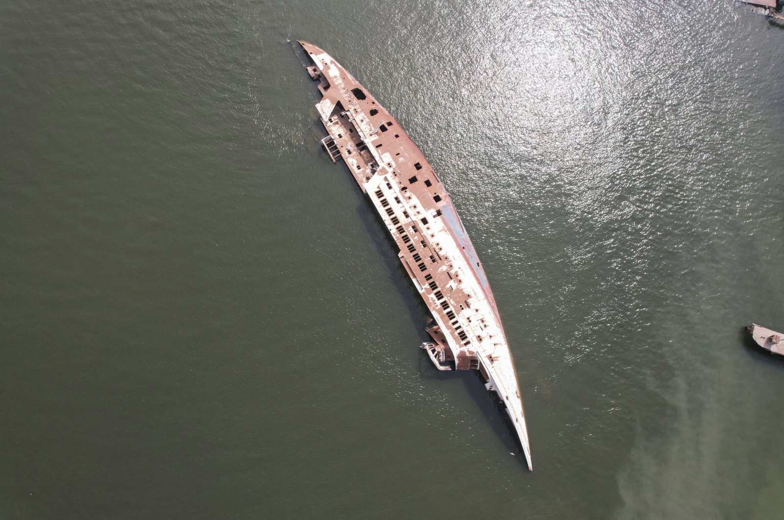 An aerial view of the &quot;Al-Mansur&quot; yacht, once belonging to former Iraqi President Saddam Hussein, which has been lying on the water bed for years in the Shatt al-Arab waterway, Basra, Iraq, March 9, 2023. (Reuters Photo)