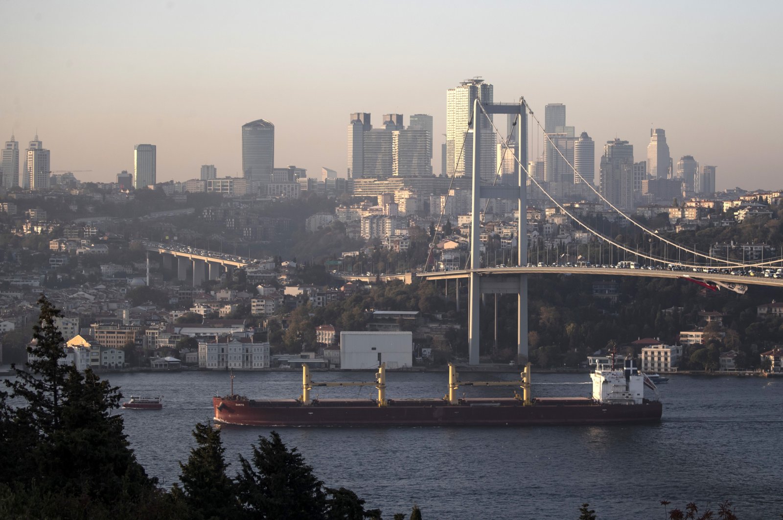 The cargo ship Zante, carrying Ukrainian grain, sails on the Bosporus under the 15 July Martyrs Bridge, in Istanbul, Türkiye, Nov. 2, 2022. (EPA Photo)