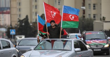 People take part in street celebrations after Azerbaijan takes control of the Lachin district in the Nagorno-Karabakh conflict, in Baku, Azerbaijan, Dec. 1, 2020. (Reuters Photo)