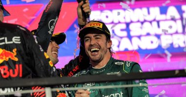 Red Bull Racing&#039;s Mexican winning driver Sergio Perez celebrates with Aston Martin&#039;s Spanish driver Fernando Alonso on the podium at the end of the Saudi Arabia Formula One Grand Prix at the Jeddah Corniche Circuit, Jeddah, Saudi Arabia, March 19, 2023. (AFP Photo)