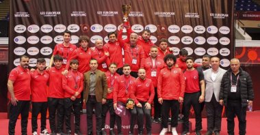 Turkish Wrestling Federation President Şeref Eroğlu poses for a photo with national wrestlers after the U23 European Wrestling Championship, Bucharest, Romania, March 20, 2023. (IHA Photo)