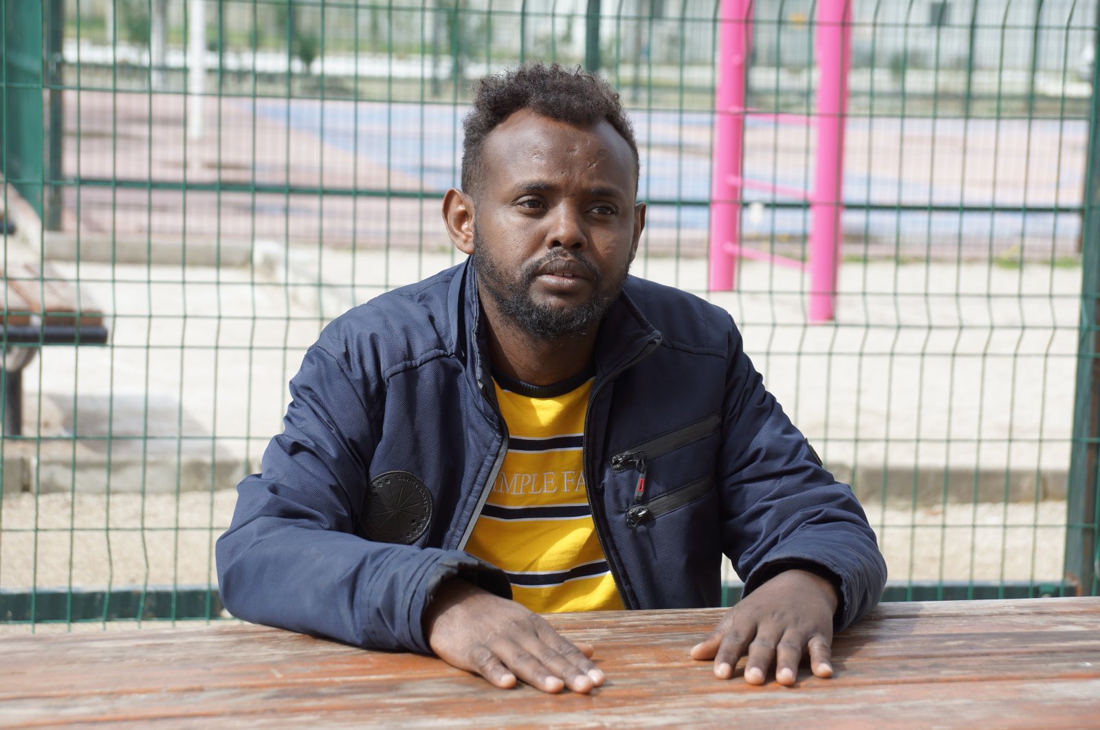 Yemeni refugee Abdullah Mohamad Isaak speaks to reporters about his encounter with the Greek coast guard in southwestern Aydın province, Türkiye, March 18, 2023. (IHA Photo)