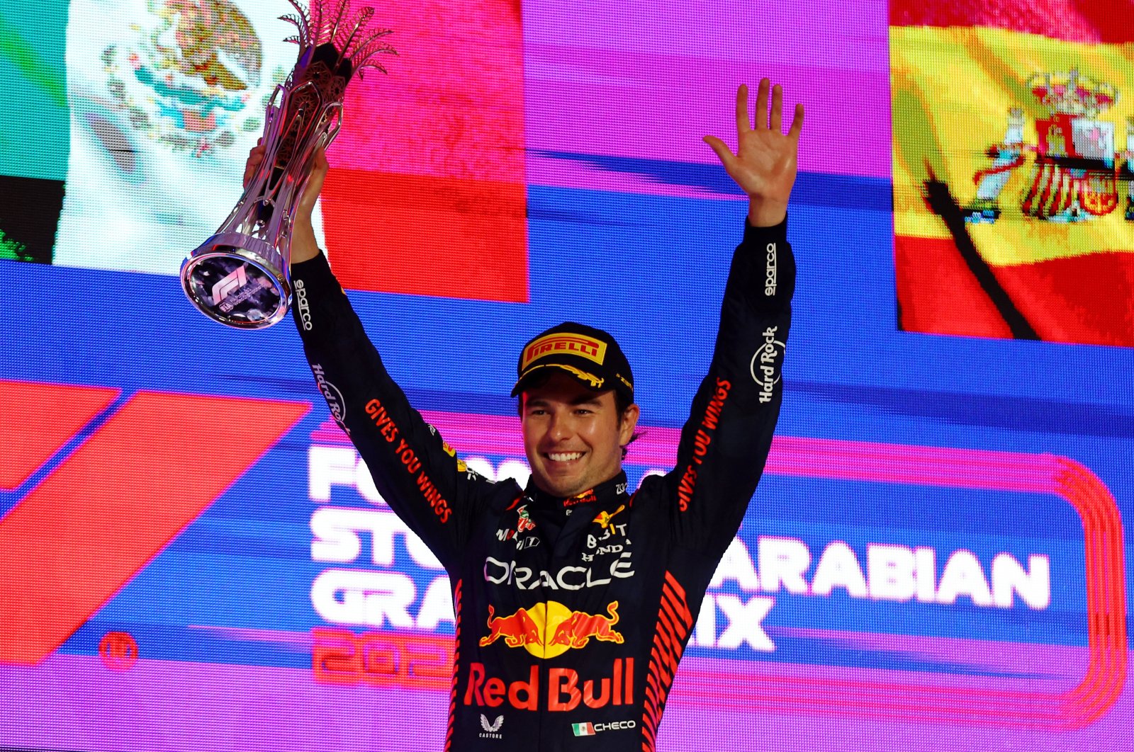 Red Bull&#039;s Sergio Perez celebrates with a trophy on the podium after winning the Saudi Arabian Grand Prix, Jeddah, Saudi Arabia, March 19, 2023. (Reuters Photo)