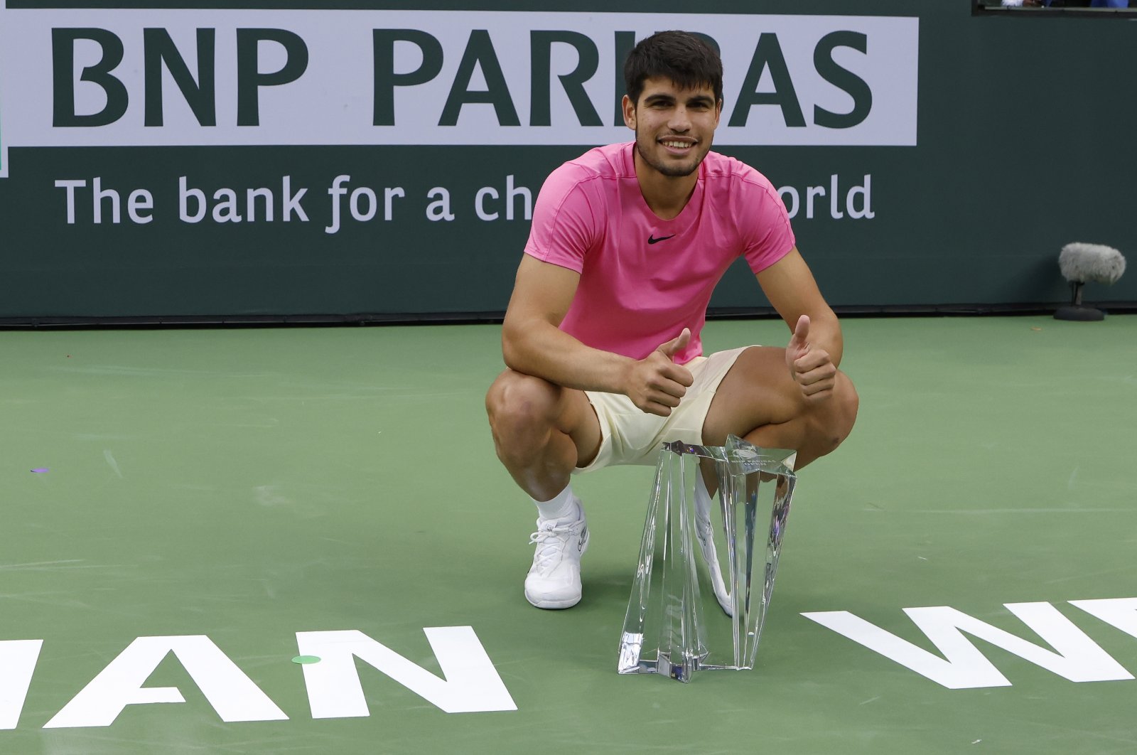 Spain&#039;s Carlos Alcaraz poses with the championship trophy after defeating Russia&#039;s Daniil Medvedev during the men&#039;s finals of the BNP Paribas Open tennis tournament at the Indian Wells Tennis Garden, Indian Wells, California, US., March 19, 2023. (EPA Photo)