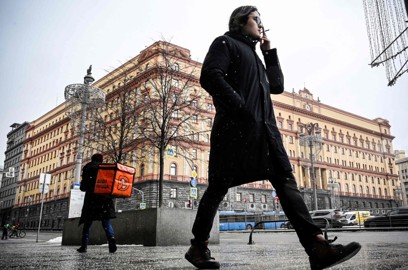 A man walks past the headquarters of the Federal Security Service (FSB), the successor agency to the KGB, and Lubyanka Square in front of it in central Moscow, Russia, March 3, 2023. (AFP Photo)