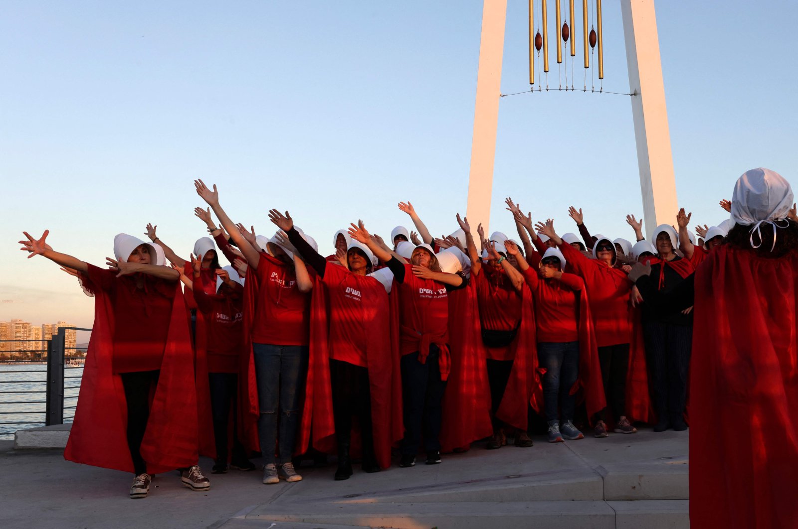 Protesters dressed as characters from The Handmaid&#039;s Tale TV series attend a protest in the city of Acre, Israel, March 16, 2023. (AFP Photo)