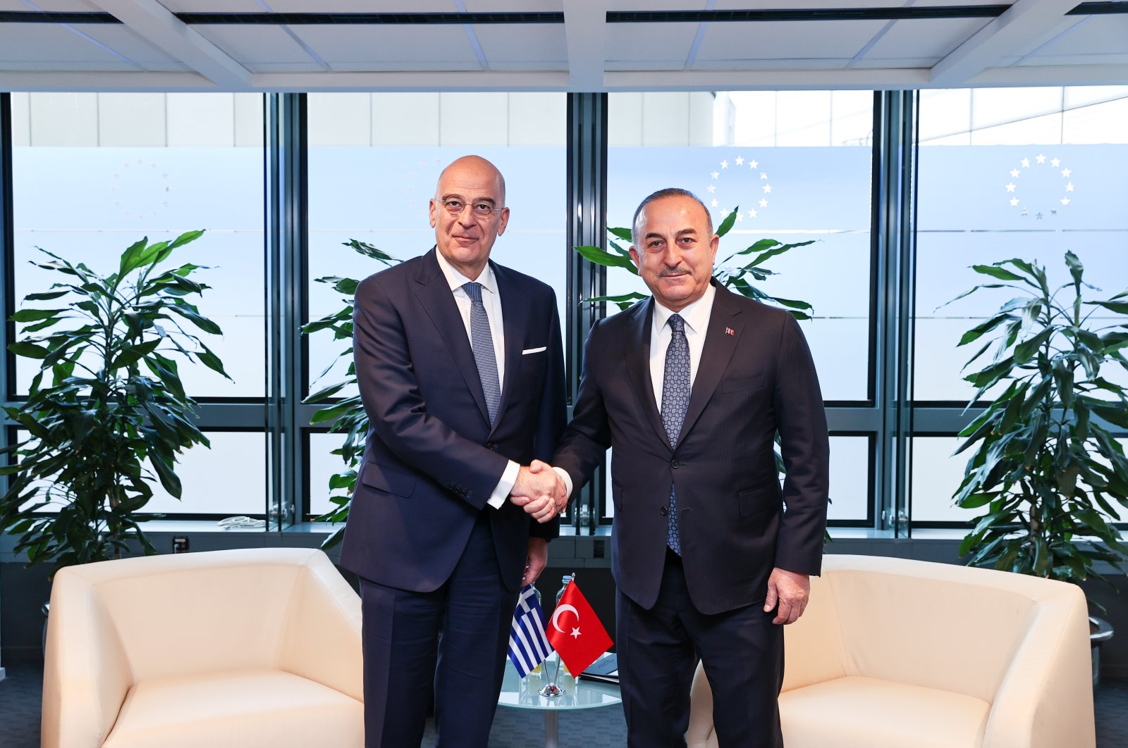 Foreign Minister Mevlüt Çavuşoğlu (R) and Greek Foreign Minister Nikos Dendias pose for a picture on the sidelines of the International Donors’ Conference in Brussels, Belgium, March 20, 2023. (AA Photo)
