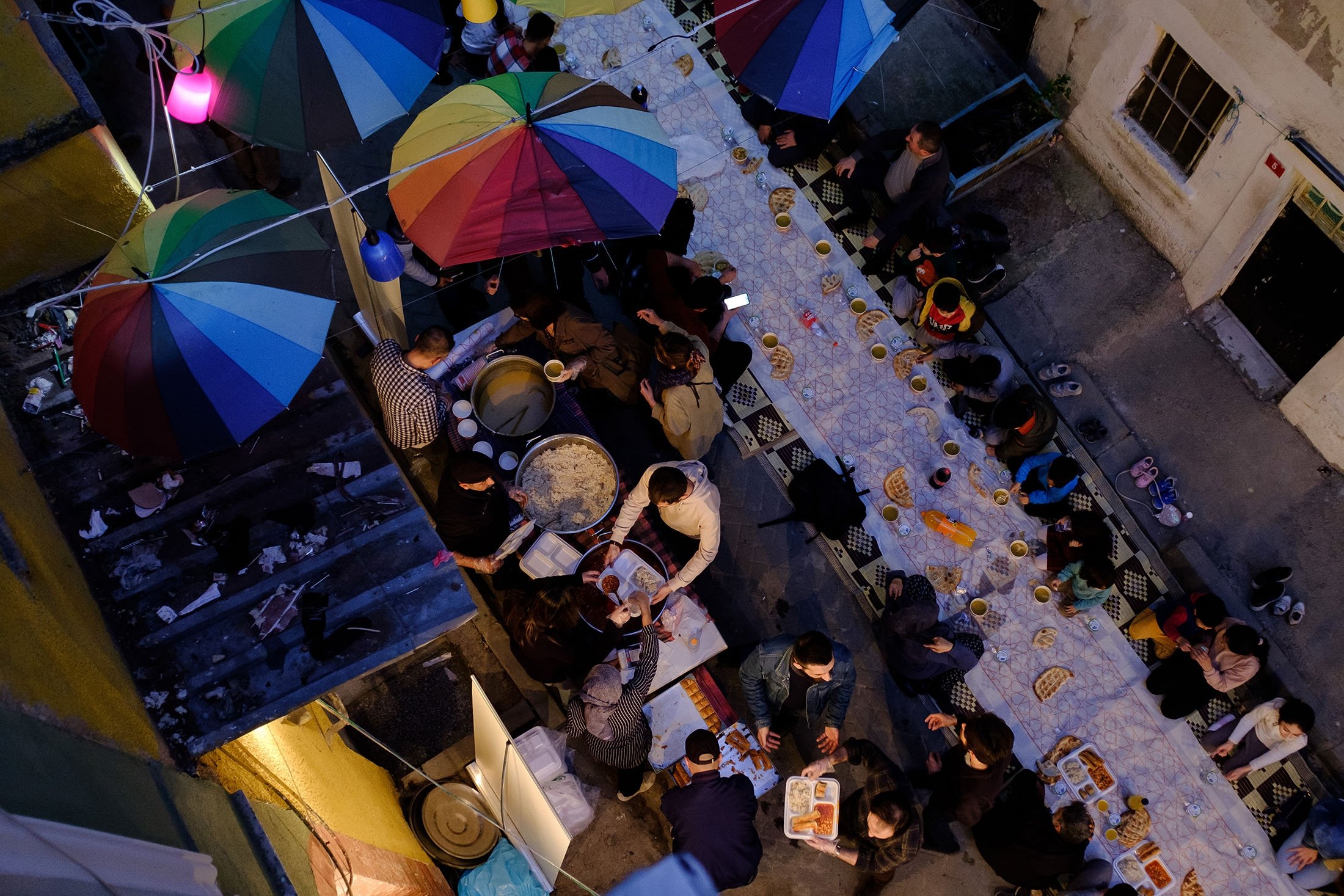 Residents partake in a street iftar in a neighborhood, in Istanbul, Türkiye, April 9, 2022. (Getty Images Photo)