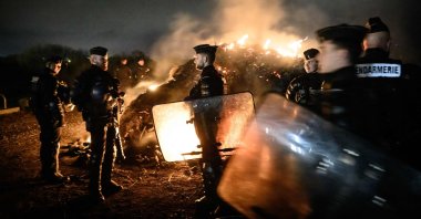 French gendarmes secure an area near an oil terminal following protests, Donges, western France, March 21, 2023. (AFP Photo)