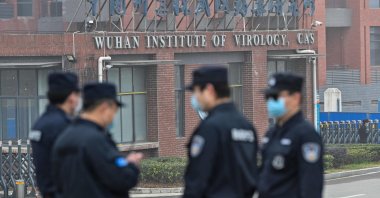 Security personnel stand guard outside the Wuhan Institute of Virology in Wuhan, China, Feb. 3, 2021. (AFP Photo)