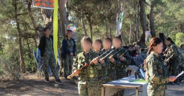 The YPG/PKK&#039;s child militants receive training at an unknown location, Aug. 3, 2018. (AA Photo)