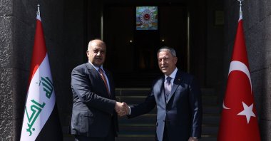Defense Minister Hulusi Akar (R) shakes hands with Iraq's Defense Minister Thabet Mohammad Saeed al-Abbasi in the capital, Ankara, Türkiye, March 21, 2023. (AA Photo)