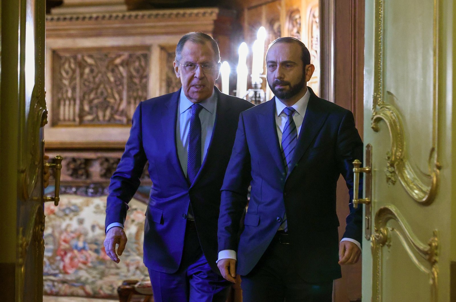 Russian Foreign Minister Sergey Lavrov (L) enters a hall with Armenia Foreign Minister Ararat Mirzoyan (R) for their joint news conference during their meeting in Moscow, Russia, March 20, 2023. (EPA Photo)