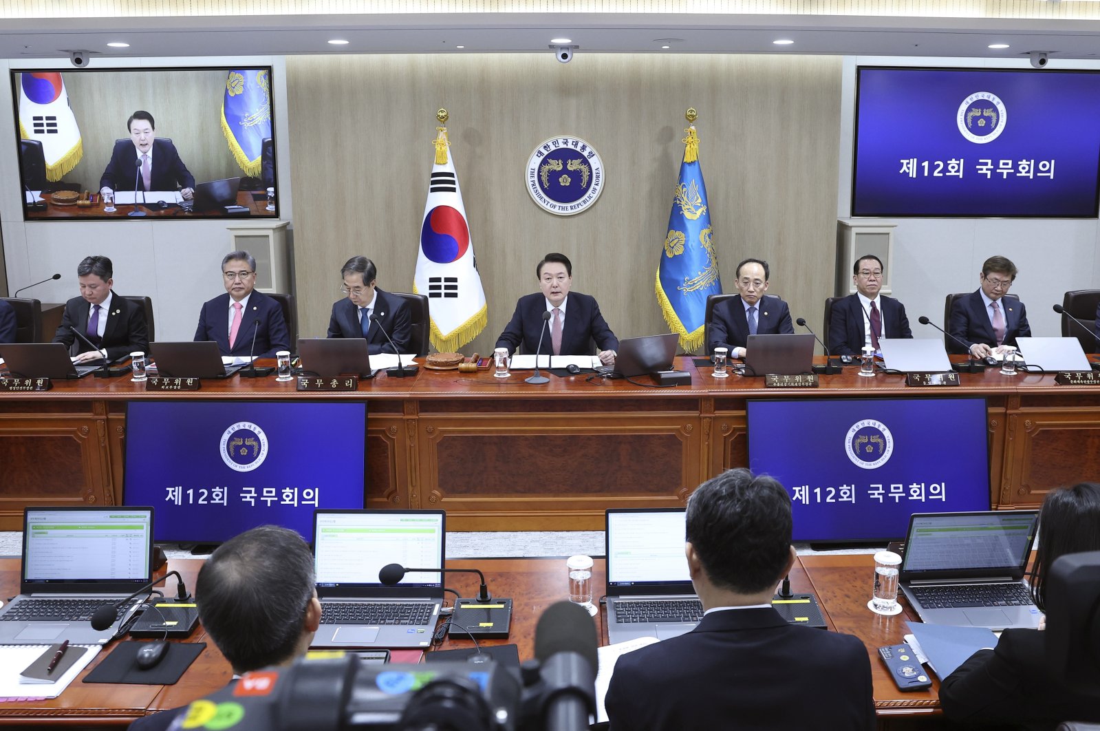 South Korean President Yoon Suk Yeol, top center, speaks during a Cabinet meeting at the president office in Seoul, South Korea, March 21, 2023. (AP Photo)