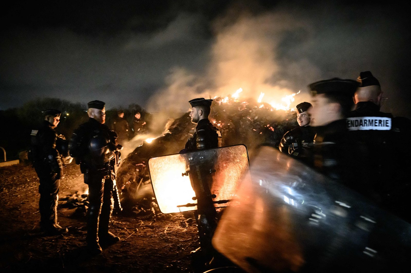 French gendarmes secure an area near an oil terminal following protests, Donges, western France, March 21, 2023. (AFP Photo)