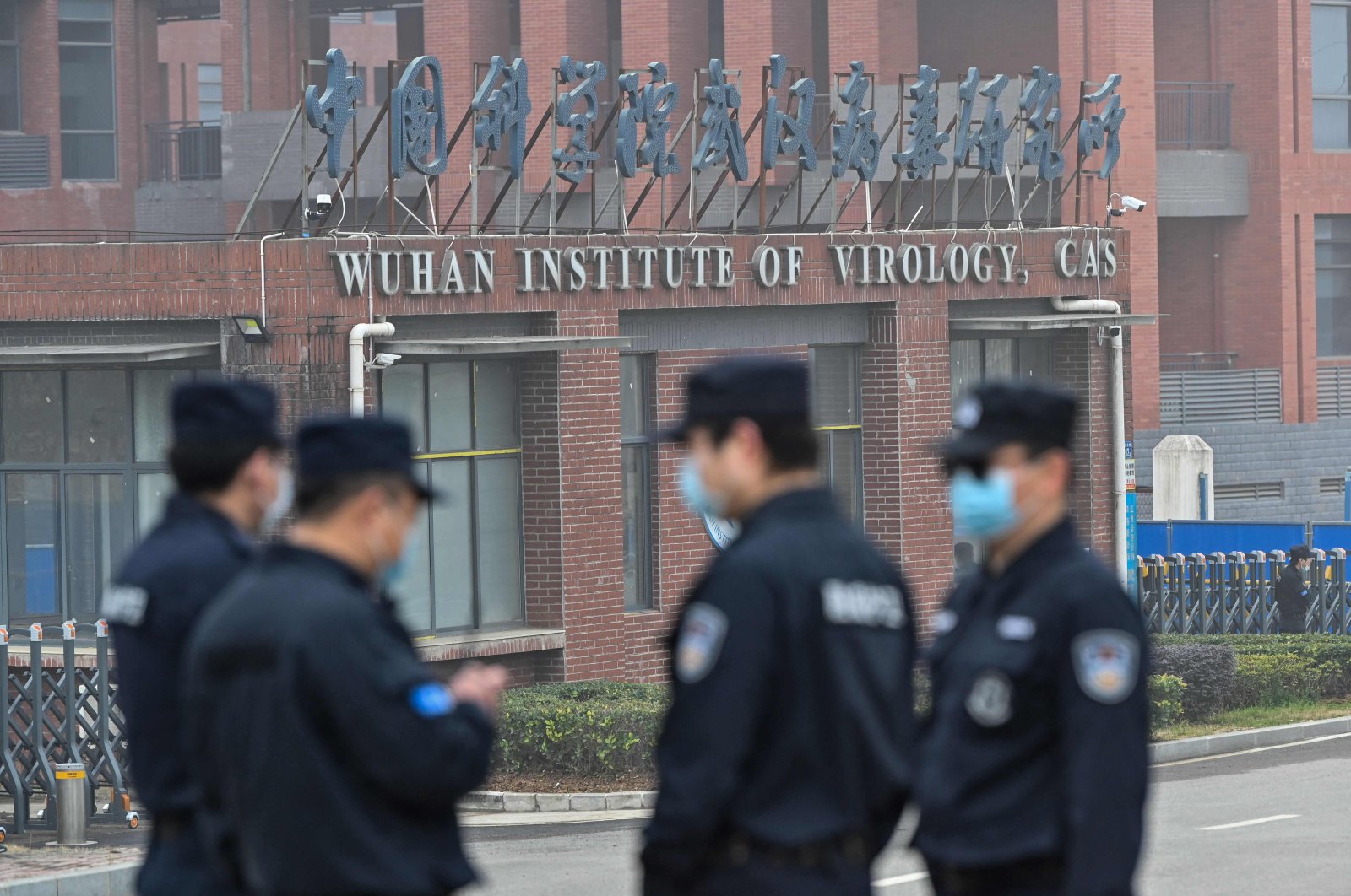 Security personnel stand guard outside the Wuhan Institute of Virology in Wuhan, China, Feb. 3, 2021. (AFP Photo)