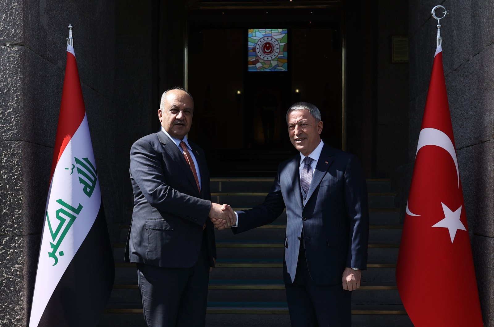 Defense Minister Hulusi Akar (R) shakes hands with Iraq&#039;s Defense Minister Thabet Mohammad Saeed al-Abbasi in the capital, Ankara, Türkiye, March 21, 2023. (AA Photo)