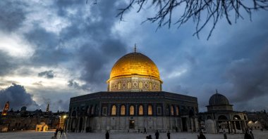 The Dome of the Rock shrine is lit up at dusk at the Al-Aqsa mosque compound, East Jerusalem, occupied Palestine, March 21, 2023. (AFP Photo)