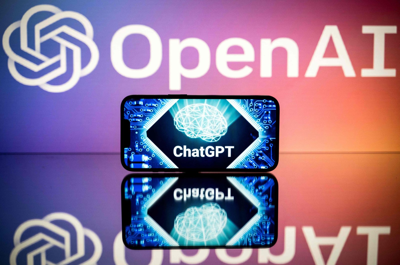 Screens displaying the logos of OpenAI and ChatGPT are seen in Toulouse, southwestern France, Jan. 23, 2023. (AFP Photo)