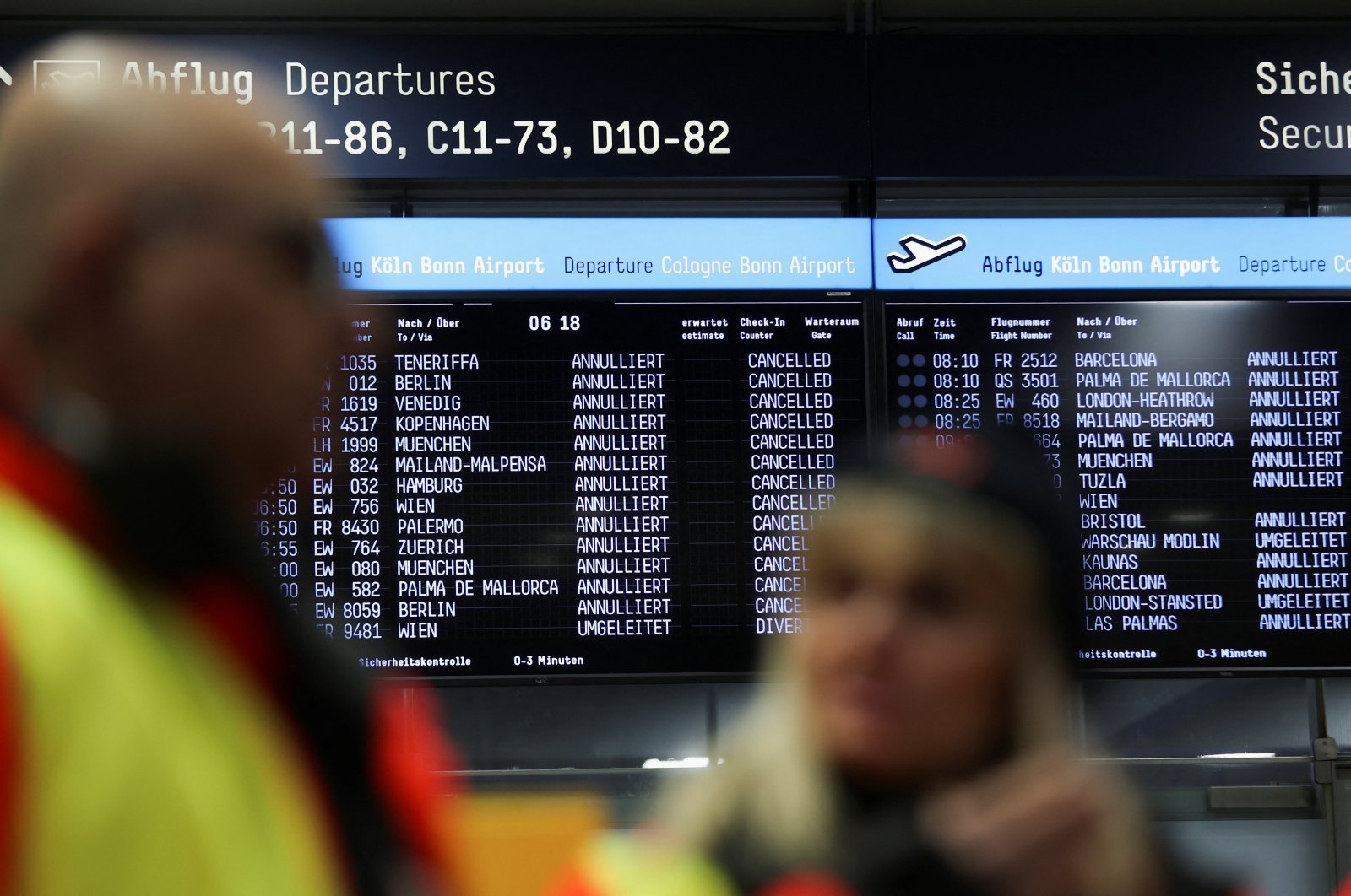 A view of timetables showing canceled flights as airport workers protest at Cologne Bonn Airport during a strike called by German trade union Verdi in Cologne, Germany, Feb. 27, 2023. (Reuters File Photo)
