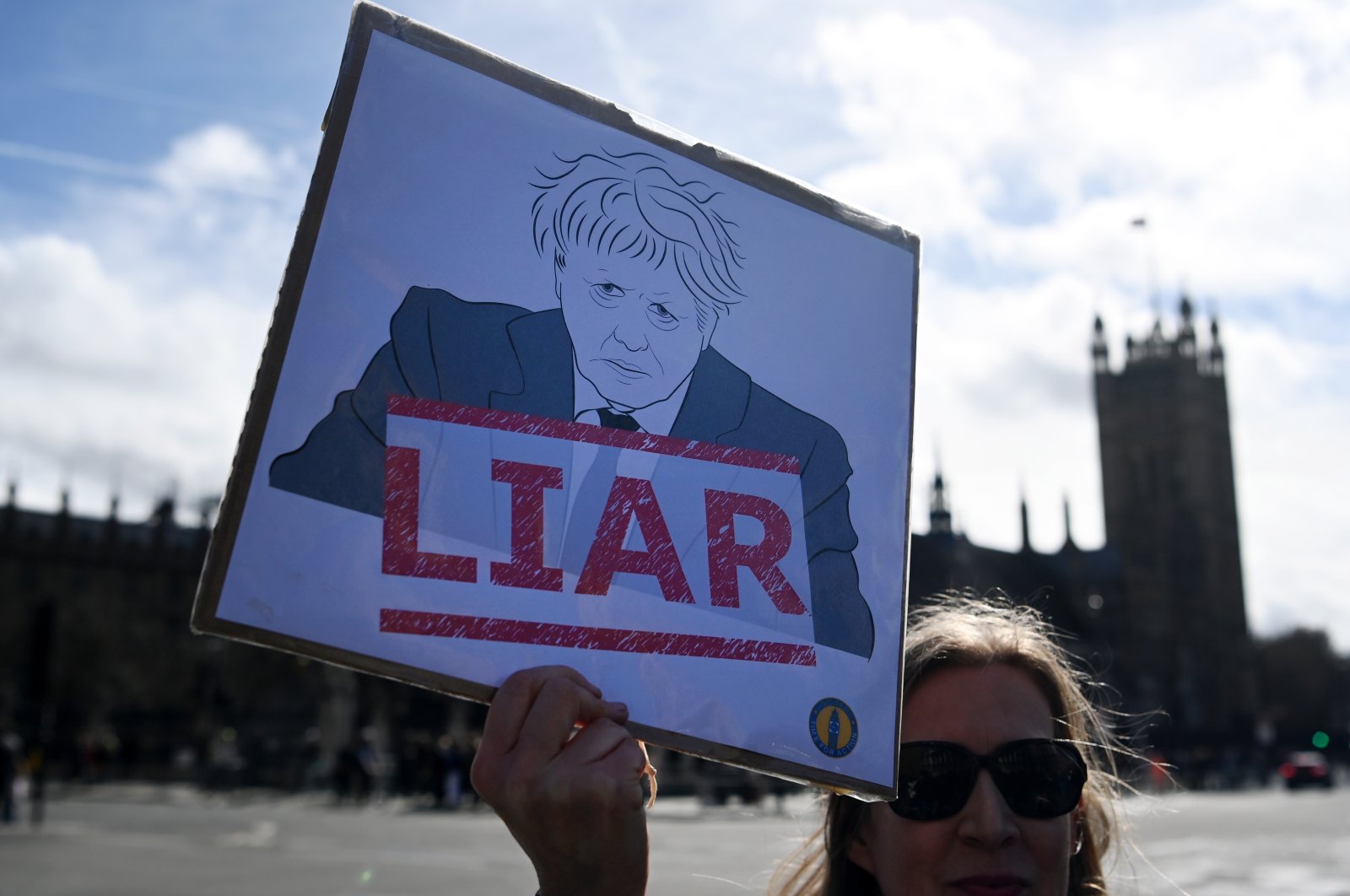 A protester demonstrates against former British PM Boris Johnson outside parliament in London, U.K., March 22, 2023. (EPA Photo)