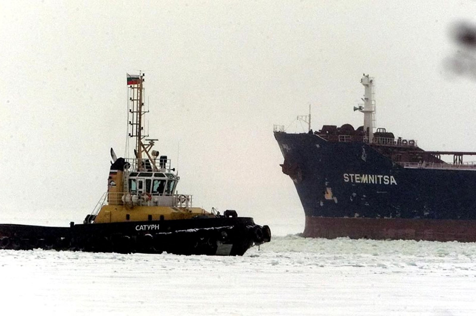 The Greek-registered ship Stemnitsa (R) with 100,000 tons of crude oil on board leaves the Russian port of Primorsk, Feb. 5, 2003. (Reuters File Photo)