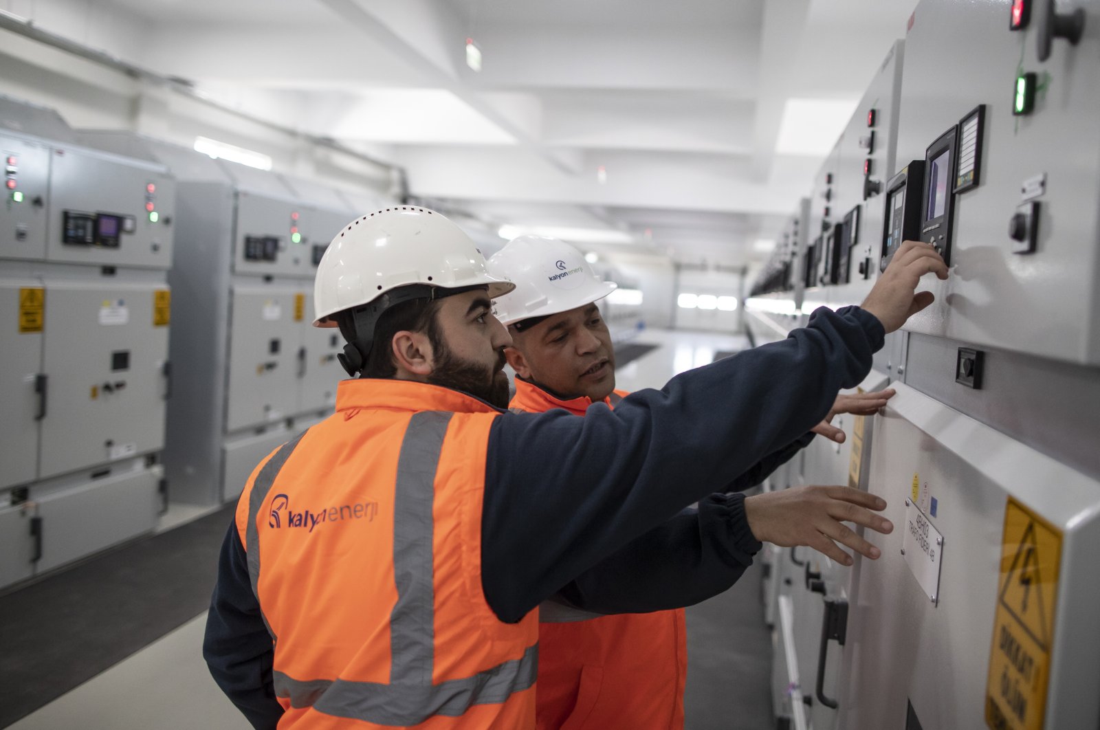 Technicians perform a routine check in the substation of the Kalyon PV Karapinar Solar Power Plant in Konya, Türkiye, Feb. 2, 2023. (EPA Photo)