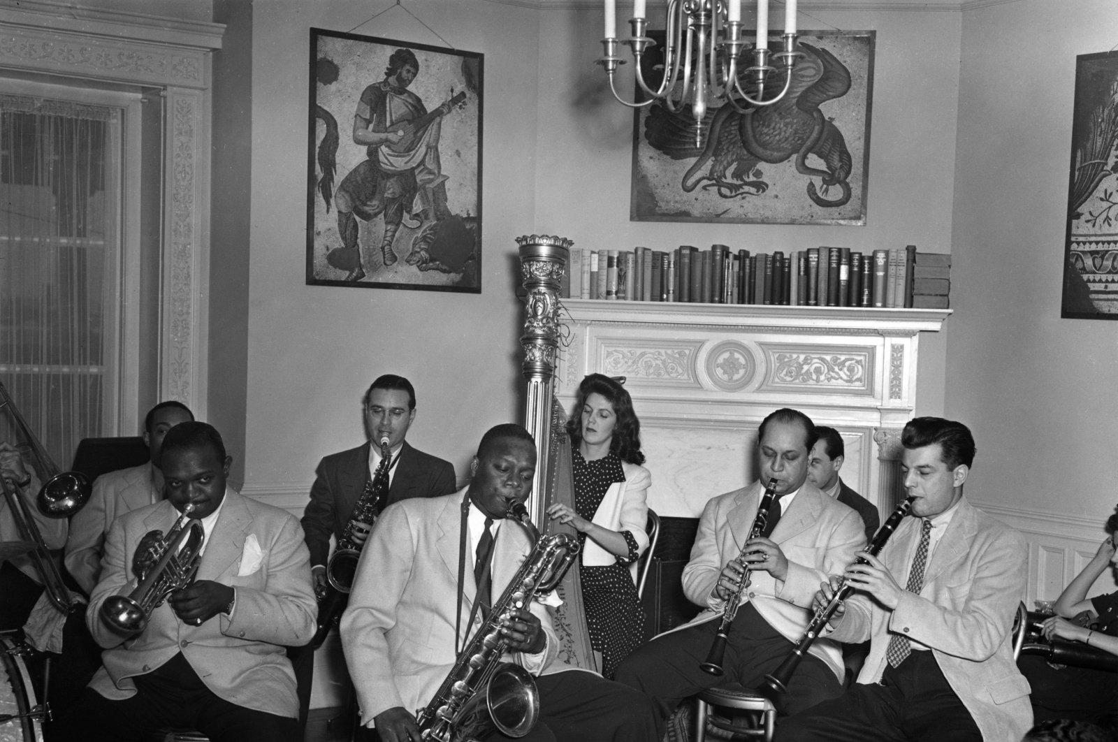 Photo of Nesuhi Ertegün, Rex Stewart (trumpet), Harry Carney (baritone), Adele Girard (harp), Barney Bigard (clarinet), Joe Marsala (clarinet) at the Turkish Embassy in Washington, U.S., Jan. 1, 1940. (Photo of Nesuhi Ertegün)