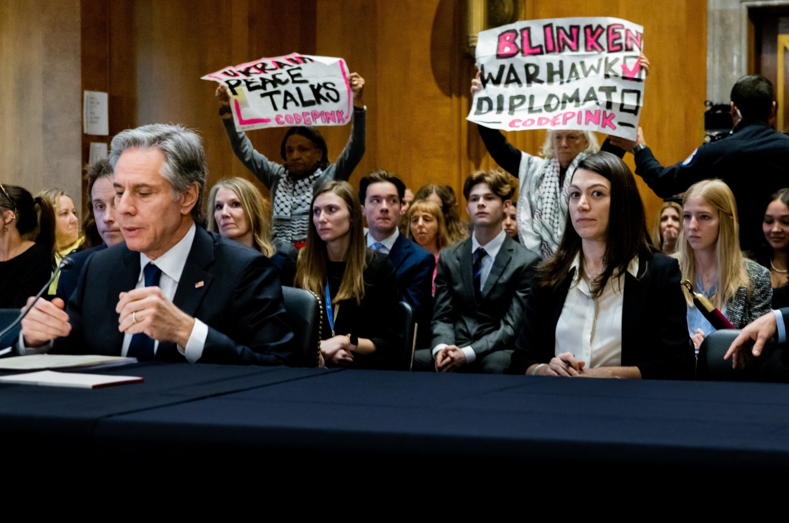 Protesters hold placards during testimony from U.S. Secretary of State Antony Blinken in Washington, D.C., U.S., March 22, 2023. (AFP Photo)