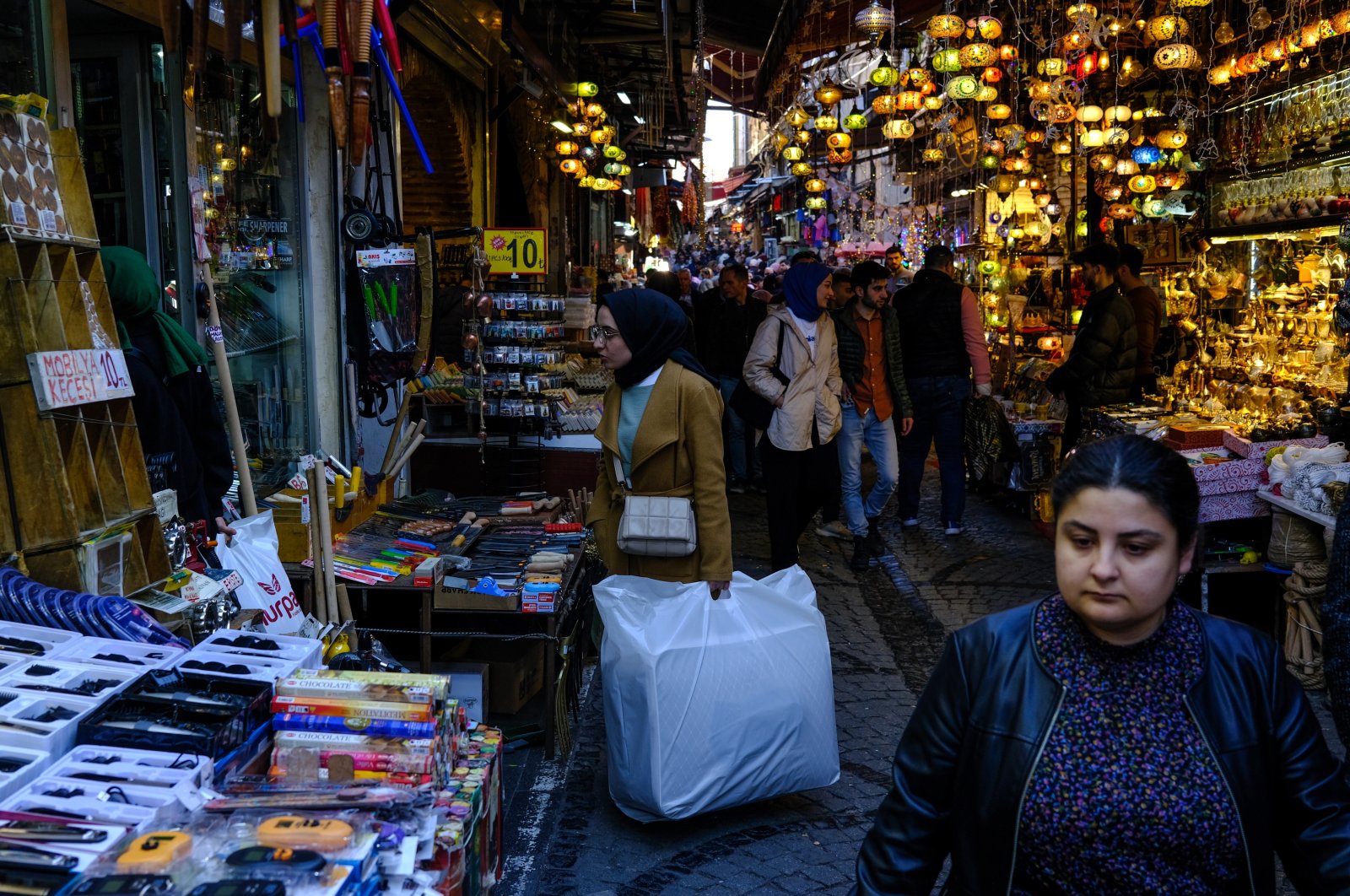 People shopping at an old city bazaar in Istanbul, Türkiye, March 15, 2023. (EPA Photo)