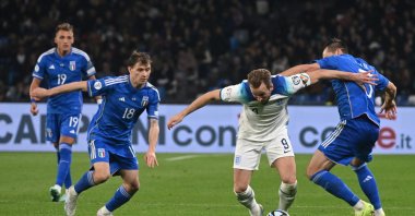 England&#039;s forward Harry Kane (C) in action against Rafael Toloi (R) and Nicolo Barella (L) of Italy during the UEFA EURO 2024 qualification match at the Diego Armando Maradona stadium, Naples, Italy, March 23, 2023. (EPA Photo)