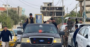 A funeral procession for Ahmet Tahir, former head of the Iraqi Turkmen Front's (ITC) Security Department, who was assassinated in his car, moves on a street in Kirkuk, northern Iraq, March 3, 2023. (AA Photo)