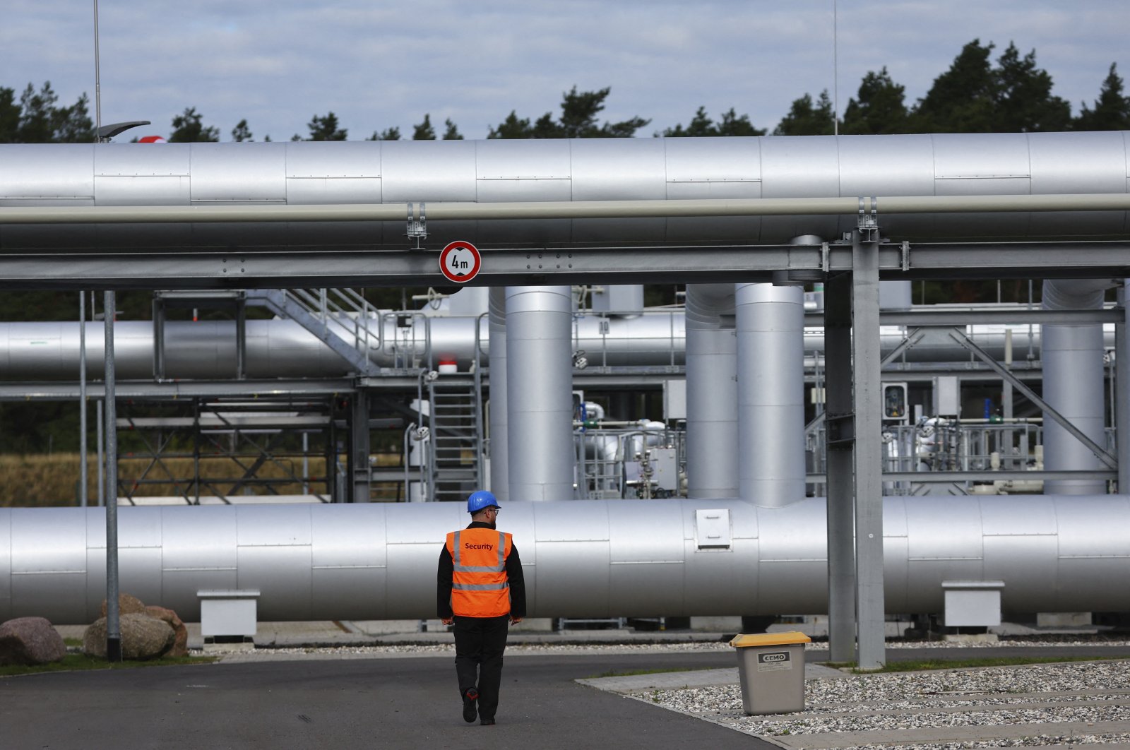A security personnel walks in front of the landfall facility of the Baltic Sea gas pipeline Nord Stream 2 in Lubmin, Germany, Sept. 19, 2022. (Reuters Photo)