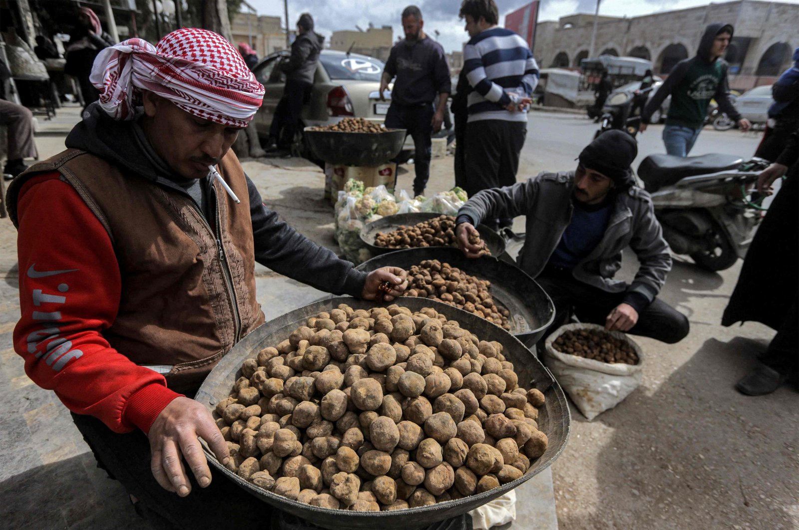 Merchants present their desert truffles at a market in the city of Hama in west-central Syria, March 6, 2023. (AFP Photo)