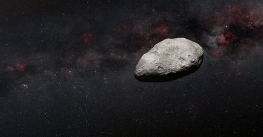 A handout artist's impression released on March 24, 2023, by the European Space Agency (ESA) shows a grey, irregularly-shaped asteroid, rocky objects that often pass safely past Earth. (Photo by Handout / European Space Agency / AFP) 