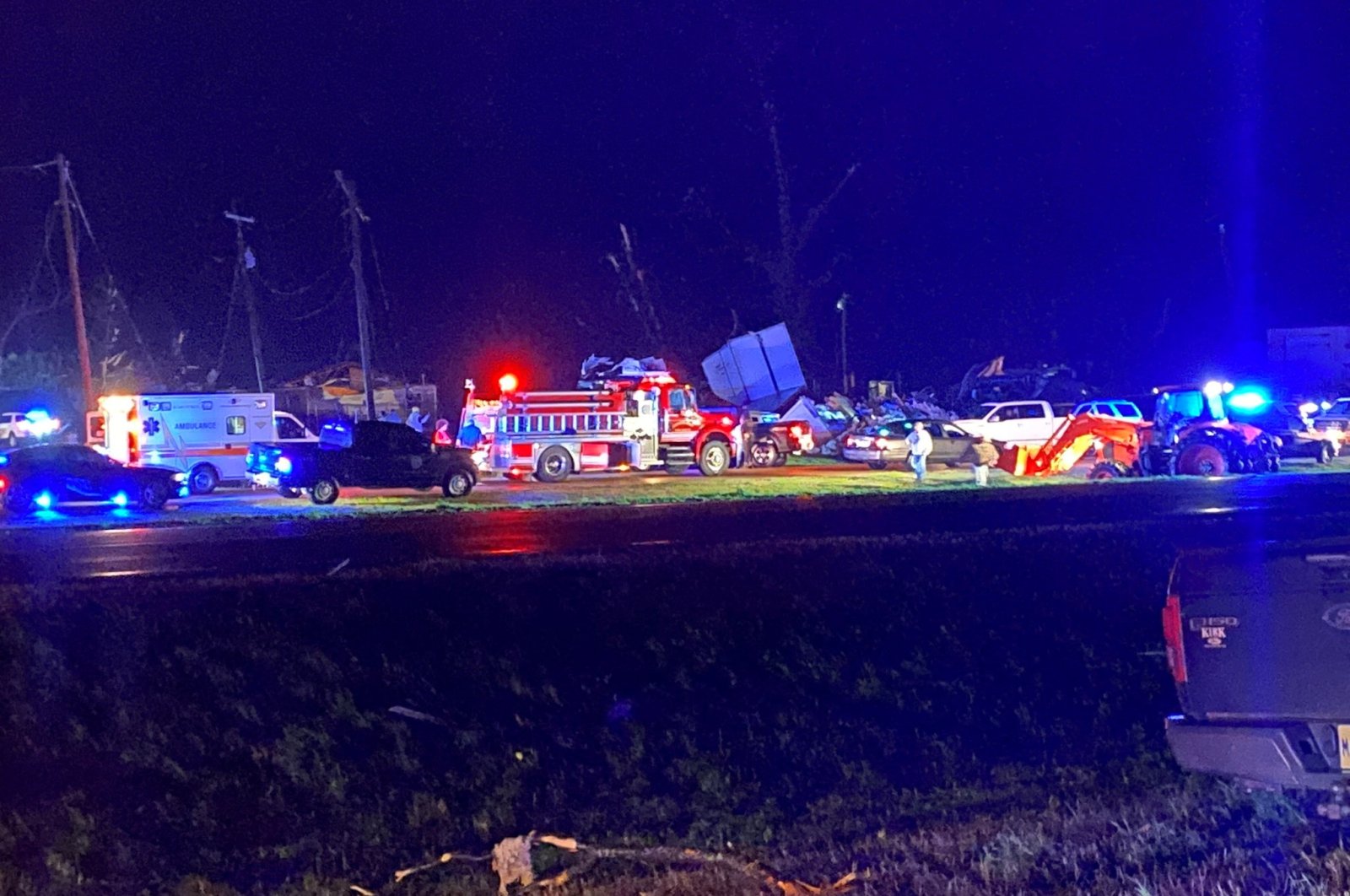 A general view shows damaged cars and structures, while emergency crews work at the scene, following a tornado in Silver City, Mississippi, U.S., March 24, 2023. (Reuters Photo)