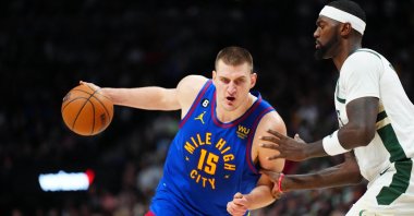 Nuggets center Nikola Jokic (L) drives at Bucks forward Bobby Portis during an NBA game, Denver, Colorado, U.S., March 25, 2023. (Reuters Photo)