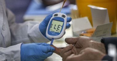 A doctor tests a local's blood sugar in Yuncheng City, Shanxi Province, China, March 23, 2023. (Getty Images Photo)