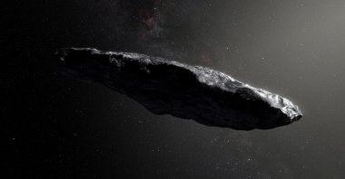 An artist&#039;s impression shows the first interstellar asteroid, &#039;Oumuamua as it passes through the solar system. (Reuters Photo)